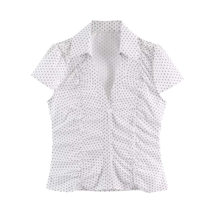 Women's V-neck short sleeve shirt with black polka dot pattern on white fabric