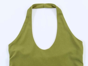 Close-up of grass green halter neckline showing fine fabric texture and stitching