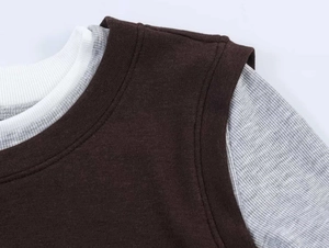 Macro detail of high-quality knit fabric with layered contrast color neckline structure