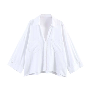 Women's minimalist oversized white cotton shirt with front pockets and button-down collar