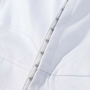 Slim fit white jacket with stand collar, asymmetric hem, and metallic hook-and-eye closures