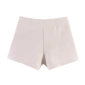 Detail of off-white high-waisted tailored shorts with clean pleats and A-line cut