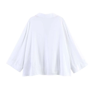 Back view of a white minimalist loose-fit shirt with dropped shoulders and relaxed silhouette