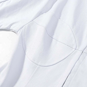 Macro view of white structured garment showing precision stitching and twill fabric texture