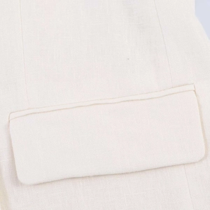 Classic white linen blazer featuring clean stitching and functional side pocket detail