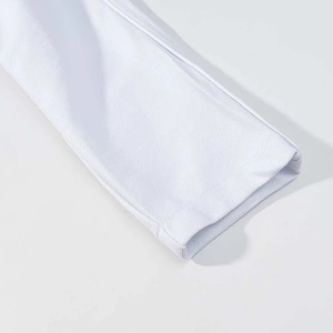 Detail of clean stitching and twill cotton fabric texture on a white jacket cuff