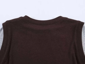 Detail of rib-knit crewneck with reinforced stitching and gray stripe contrast fabric