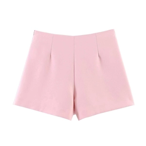 Detail view of high-waisted light pink shorts with pleated design and smooth fabric finish