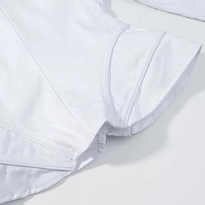 Detail shot of white slim-fit jacket showing ribbed fabric texture and stitching patterns