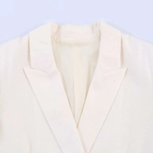 Minimalist white linen blazer with classic peak lapel design and premium stitching