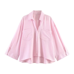 Minimalist light pink loose fit long sleeve shirt with front pockets and curved hemline