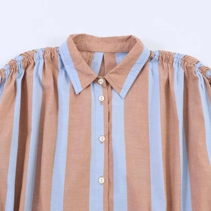 Vintage brown and blue striped sleeveless shirt with pleated shoulder details and lapel