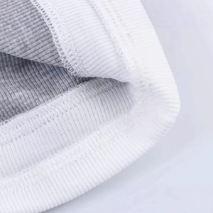 Minimalist grey and white faux two-piece long sleeve knit top with ribbed neckline details