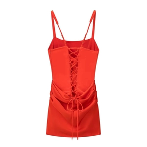 Detailed back view of red satin mini dress featuring cross lace-up design and slim straps