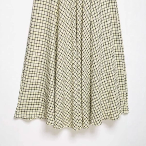 Women's high waist A-line midi skirt featuring retro yellow and black plaid fabric texture