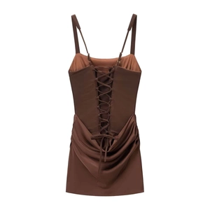Detail of corset-style lace-up back and draped fabric on chocolate brown mini dress