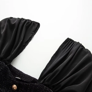 Elegant black tweed top with puff chiffon sleeves and decorative gold button detail