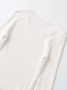 Detail shot of white ribbed knit fabric texture and high-quality neckline stitching