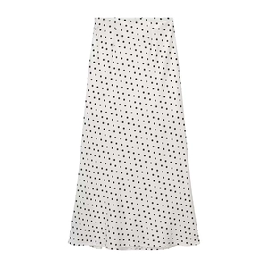 Jupe mi-longue à pois taille haute blanche et noire pour un look d'été rétro français
