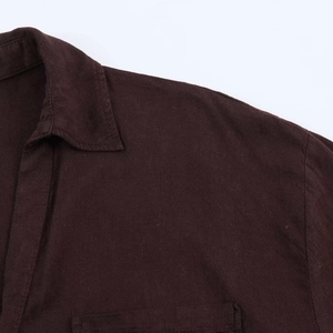 Close-up of chocolate brown shirt showing collar detail and corduroy texture