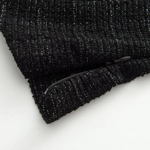 Elegant black tweed puff sleeve top with silver metallic yarn and invisible zipper
