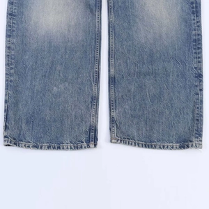 Detailed close-up of distressed denim hems with vintage wash and frayed edge effects