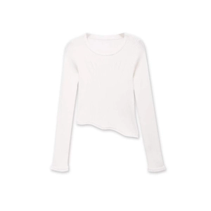 White long sleeve knit top with asymmetric hem and subtle jacquard texture pattern