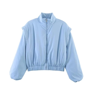 Close-up of light blue bomber jacket with stand collar and textured fabric detail