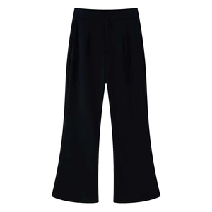 Detail of high-waist black wide-leg trousers with elegant front pleats and drape