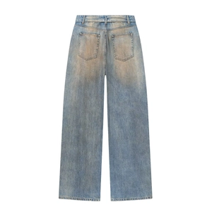 Vintage light blue wide leg jeans with yellow distressed wash and straight cut