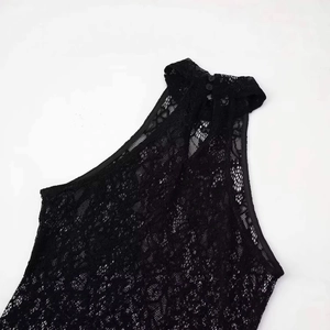 Black halter neck lace knit maxi dress with delicate floral cutouts and button closure