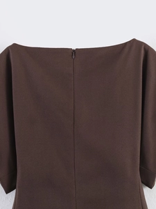 Close-up of chocolate brown off-shoulder top featuring a seamless back invisible zipper