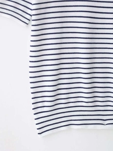 Close-up of navy and white striped knit fabric showing high-quality texture and pattern