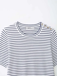 Detail of nautical striped knit top showing round neck and gold buttons on the shoulder