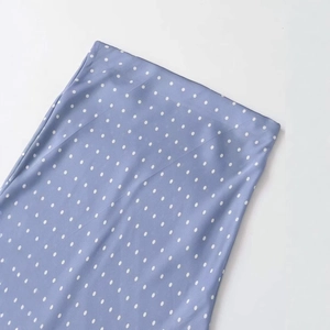 Elegant light blue polka dot satin midi skirt with high waist and mermaid silhouette
