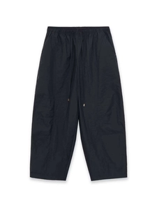 Detail view of quick-dry loose trousers showing elastic drawstring waist and fabric texture