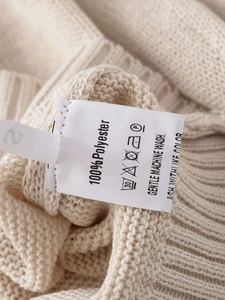 Detail shot of the garment wash label showing 100% polyester composition and size tag