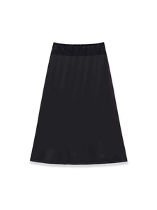 Detail of the high waist black A-line skirt featuring delicate floral lace trim