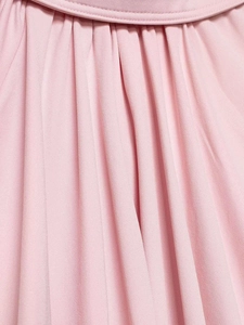 Macro detail of pink bubble sleeve shirt fabric showing neat stitching and soft texture