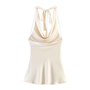 Close-up of champagne satin halter top featuring an elegant cowl neck and silky texture