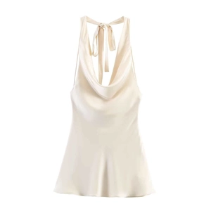 Satin halter neck top in champagne with cowl neck and backless tie design on white background