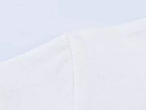 Close-up detail of reinforced shoulder stitching on this white cotton t-shirt for women