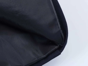 Macro shot of durable navy blue nylon lining and meticulous edge stitching of the blazer