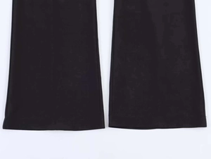 Detail view of double-needle stitched hem on black wide-leg trousers for quality finish