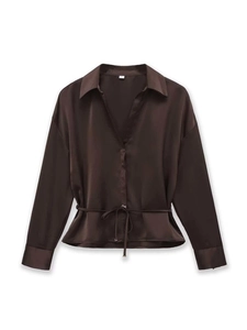 Detailed view of dark brown satin shirt featuring a V-neck, waist tie, and glossy silk texture