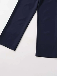 Detail view of navy blue straight-leg trousers showing neat hem stitching and smooth fabric