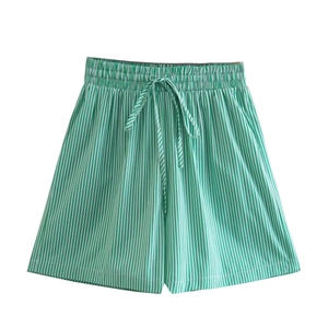 Detail view of high-waist green and white striped casual shorts with drawstring waist