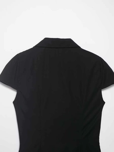 Rear view of a slim fit black polo top with short sleeves and high-quality cotton texture