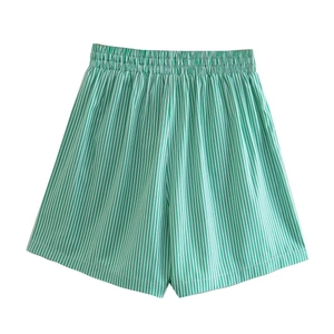 Detail of high waist green and white striped casual shorts with elastic waistband