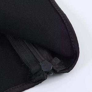 Black halter top featuring textured fabric and a high-quality metallic zipper detail